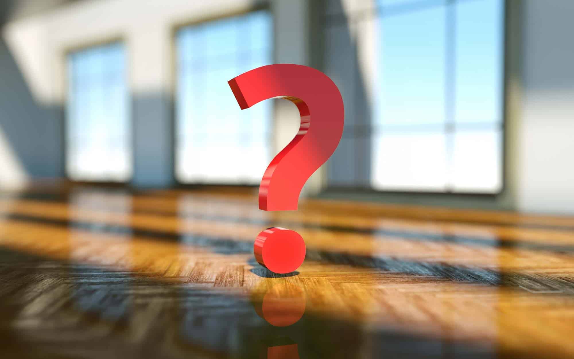 Question Mark in an empty room with no furniture representing Real Estate Buyer FAQs
