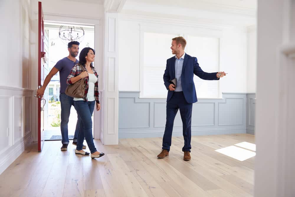 Realtor Showing New Home to a young couple