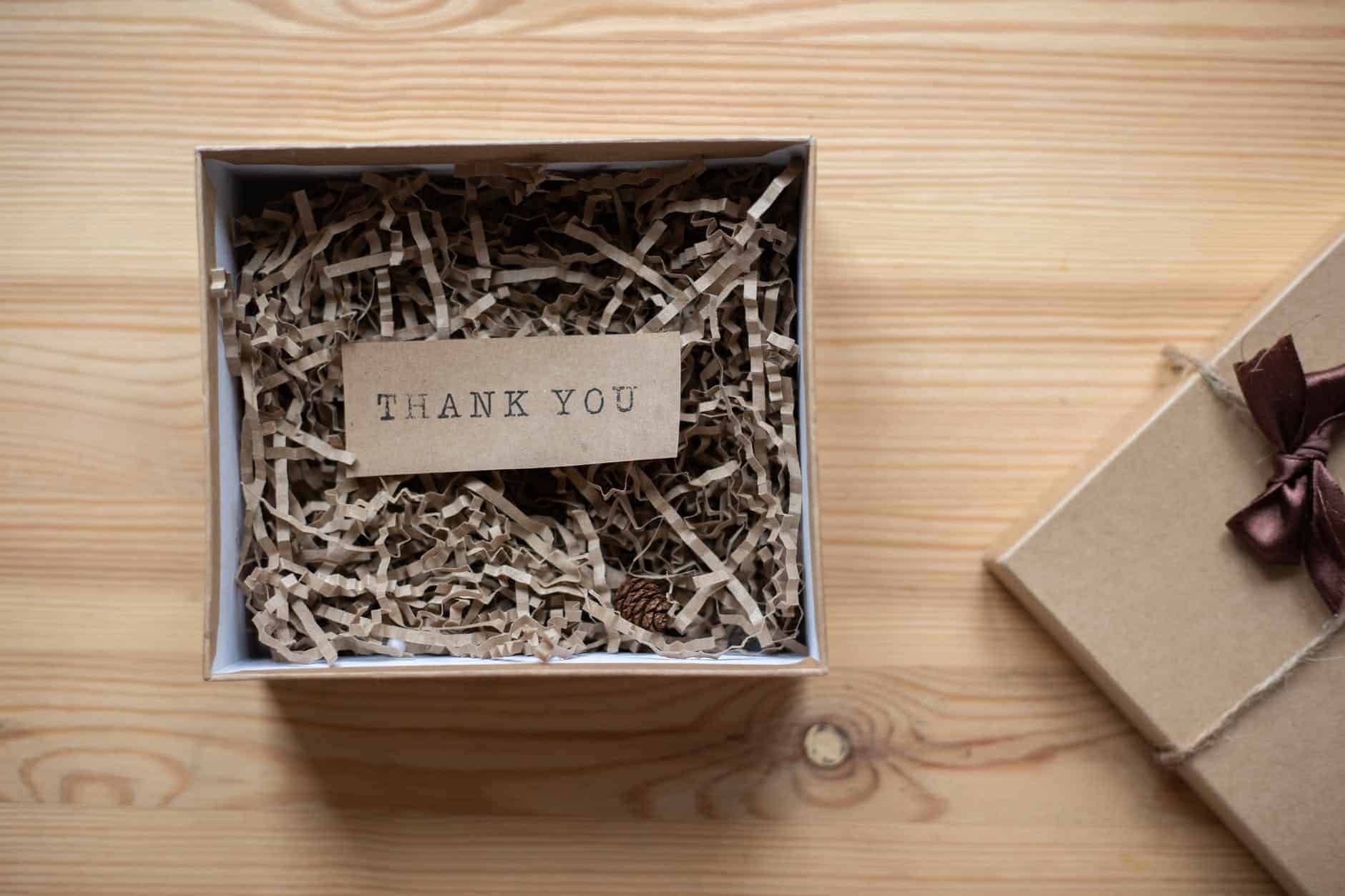 Small open box with a thank you label in it