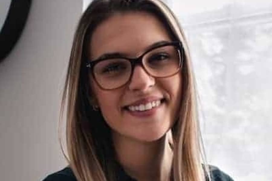 Woman smiling while wearing glasses