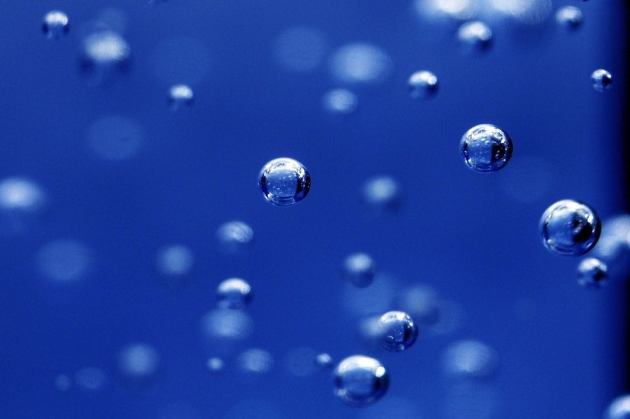 bubbles floating around with a blue backgrounds